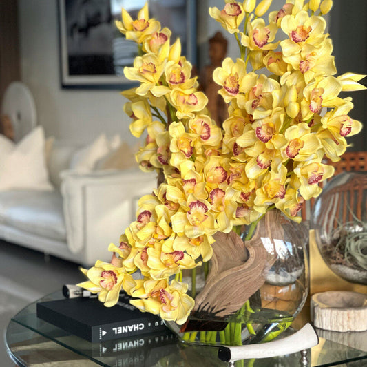 Cymbidiums Amarillos en Vaso Lunar